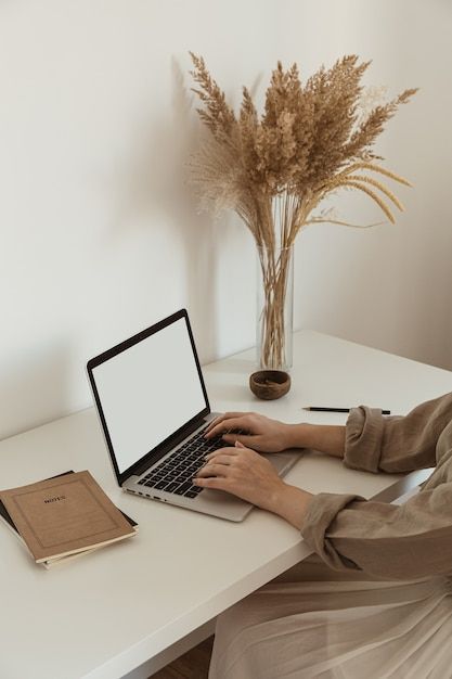 Premium Photo | Beautiful woman working, typing on laptop. Cozy comfortable home office workspace interior design