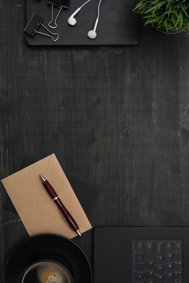 Free Photo | Workplace with smartphone, notebook, on black table. Top view